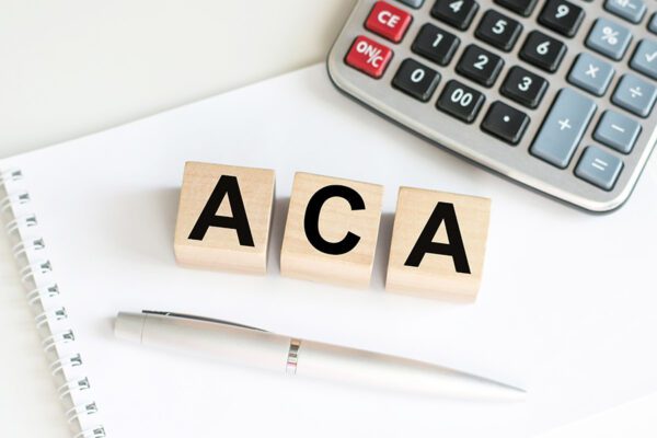 "ACA" inscription on wooden cubes isolated on white background, medicine concept.